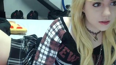 Blonde teen in solo action with her pussy