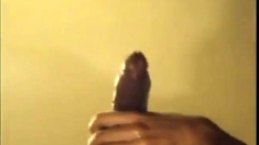 Black guy jacks off his big cock and cums hard